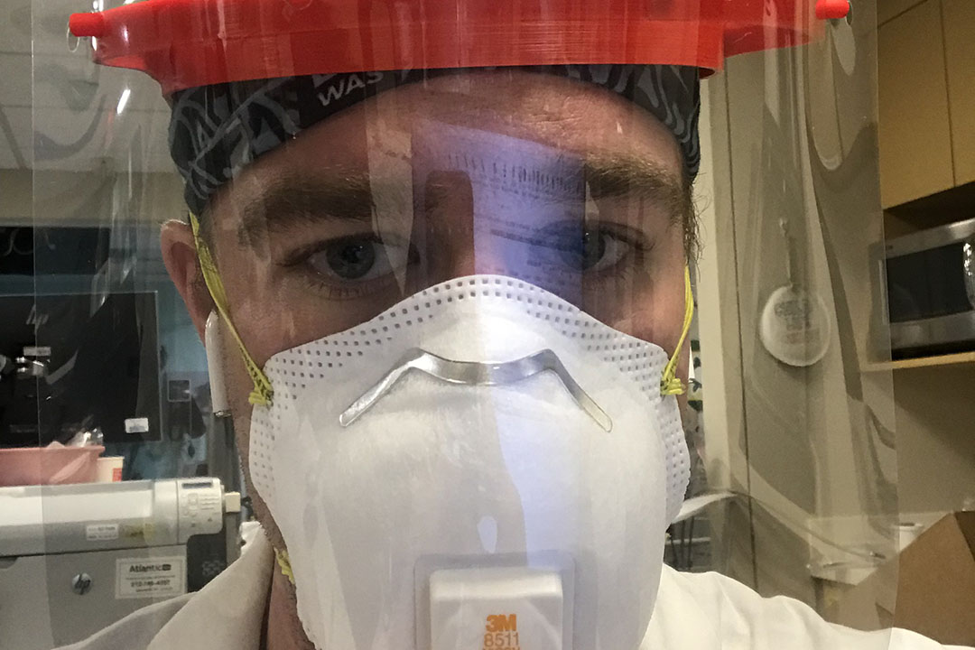 Dr. Luke Fey, BS ’13, wearing an N95 mask