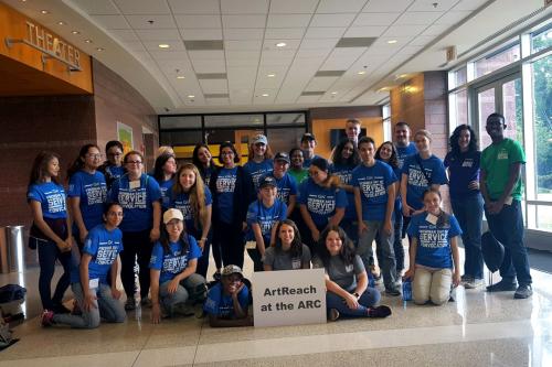 Group of students posing at THEARC theater during a GW Biology Department volunteer event